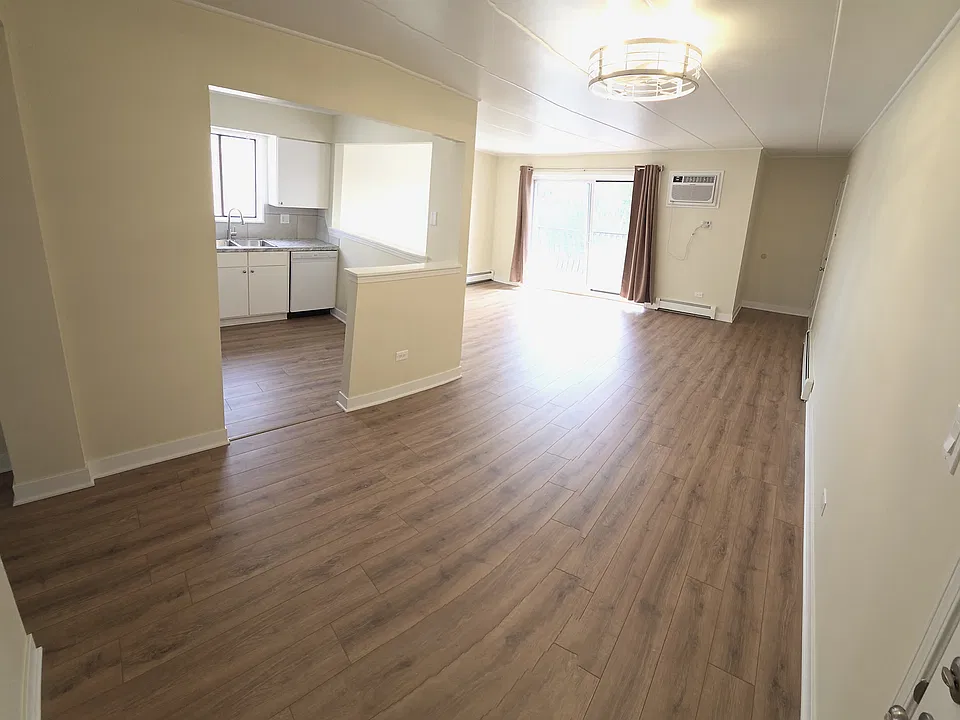 Fully remodeled living room & dining room. New flooring, windows, AC unit, baseboards, blinds, etc.