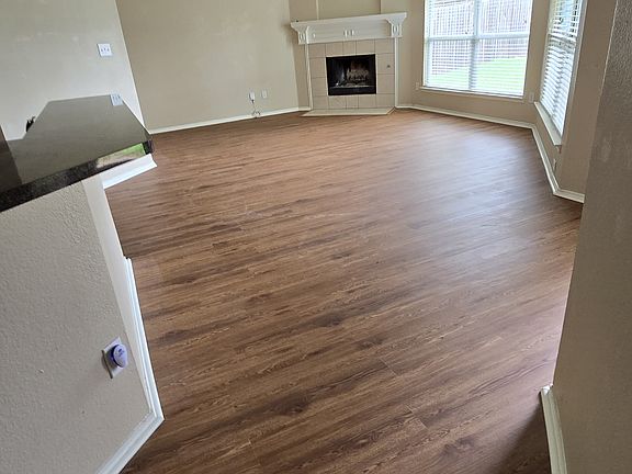 Living/dining room with gas fireplace.