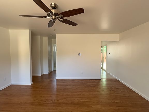 Living to kitchen on right, toward bath and hall in middle. Toward front bedroom on left