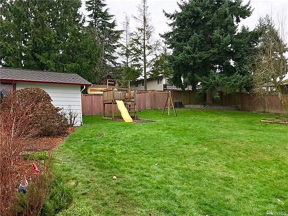 Swing set stays, take advantage of the lovely days. Mature blueberry bushes allow you to enjoy their fruits in the summer.