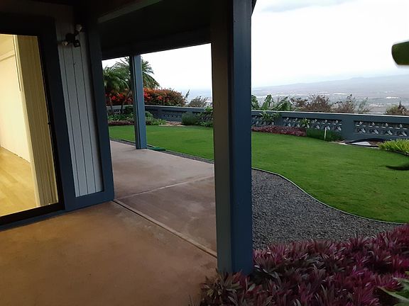 Entry view of covered 380 sf patio plus a (landlord maintained) garden area.