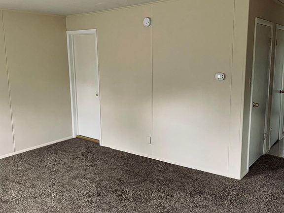 Living room, bathroom door on left.