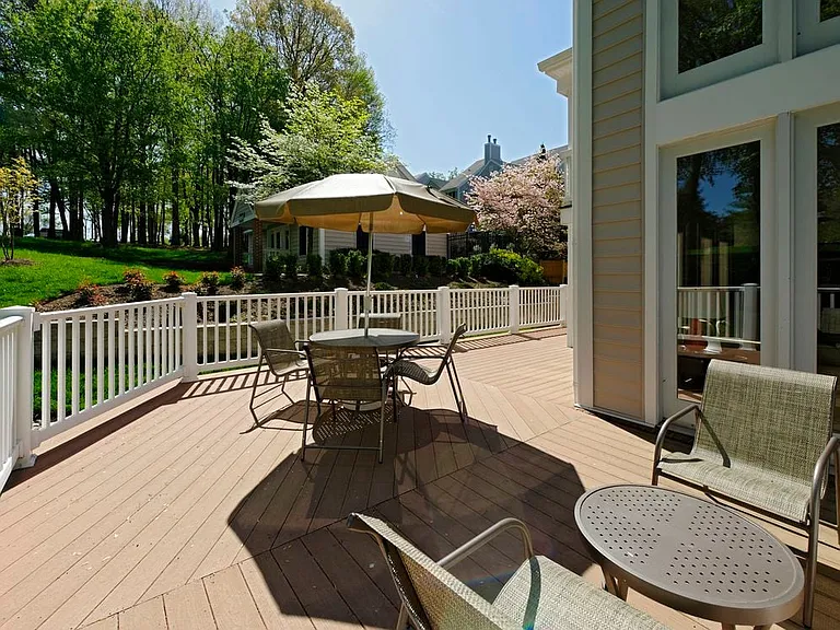 Resident lounge patio with dining area with seating