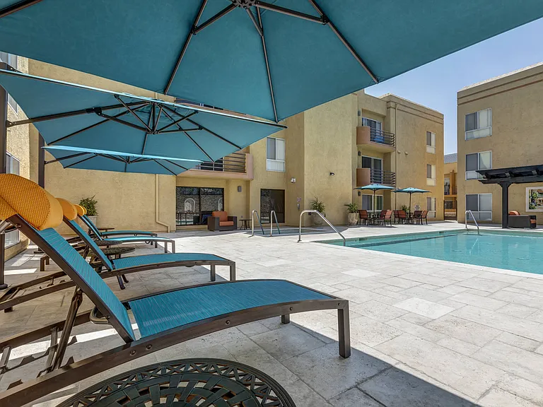 Apartments in Burbank, CA - Pool, Patio and Jacuzzi with Pergola with Fire Pit and Seating.jpg
