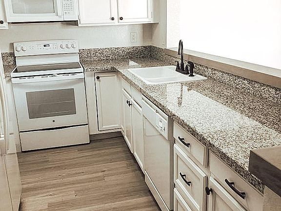 New granite kitchen counters, range and dishwasher.