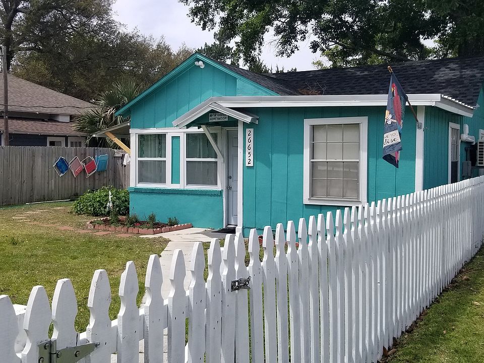 Front. Park to right of fence