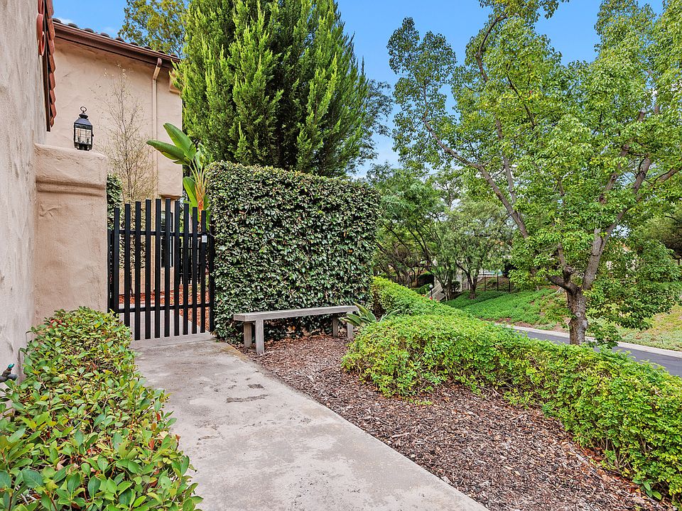 Corner lot on top of a hill. Courtyard entry via house gate.
