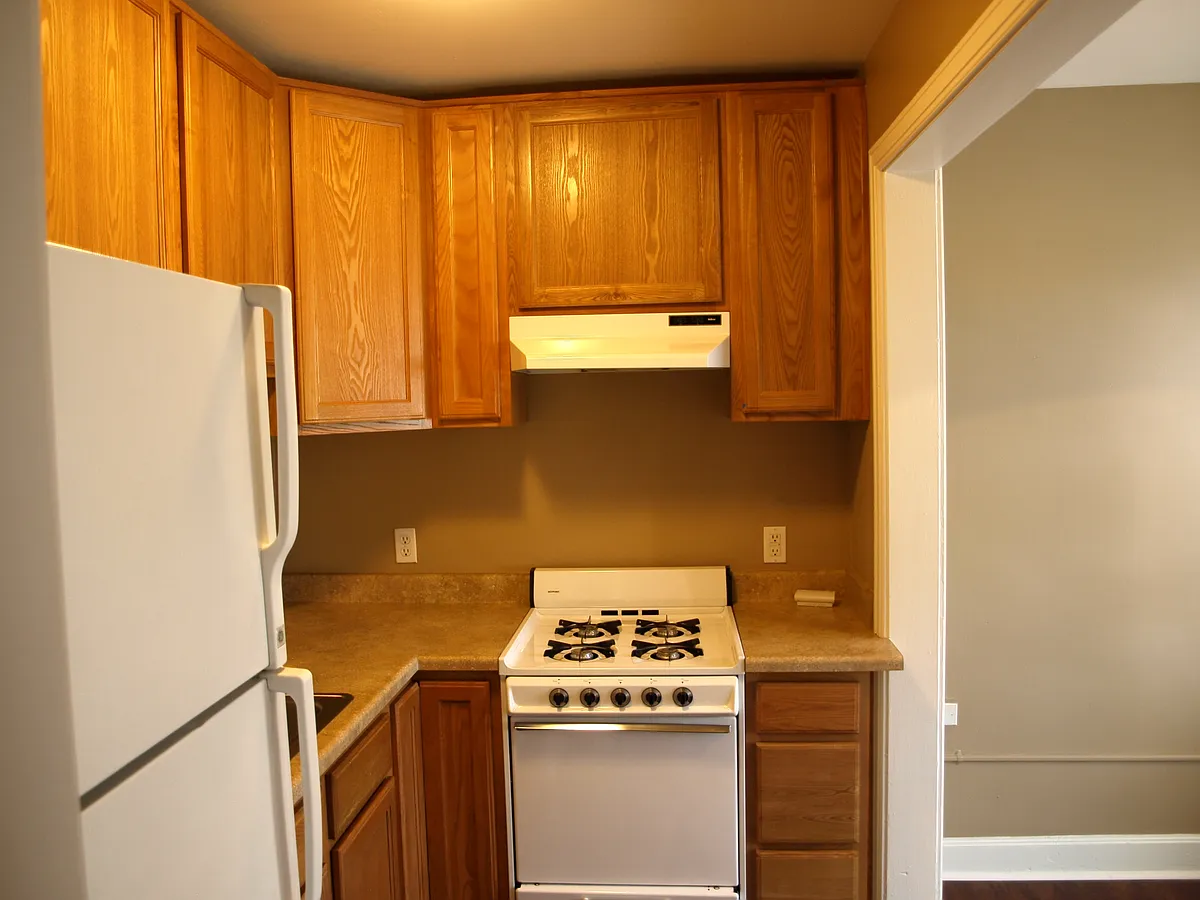 DINING AREA OFF KITCHEN WHITE GAS STOVE - 1530 N Downing St #206