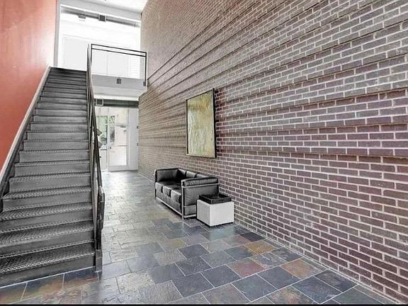 Enjoy this inviting entryway. Front and back doors require a fob or pass code to enter.