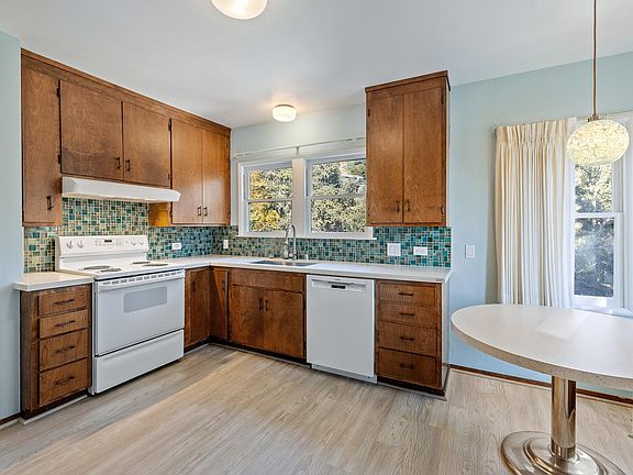 The kitchen has recently been updated with new stone counters, a new dishwasher, sink, faucet, refridgerator. The stove is electric.