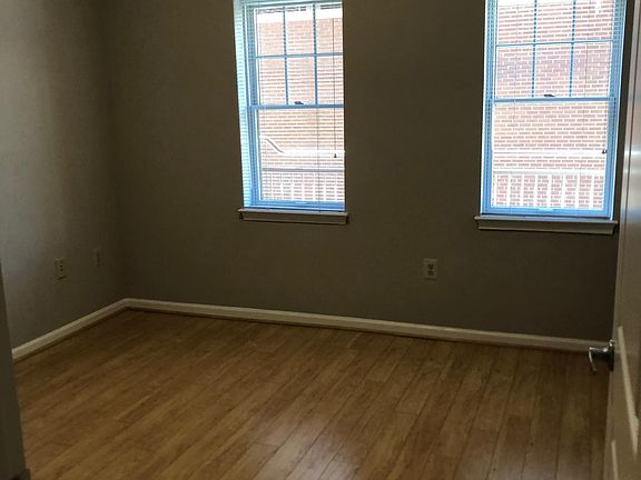 Bedroom 1. Both bedrooms are equal size; bedroom 2 has a balcony.