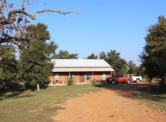 Wonderfully secluded country home with modern features!  Metal Roof, Large covered front porch, Spray foam insulation, dreamy master bathroom.