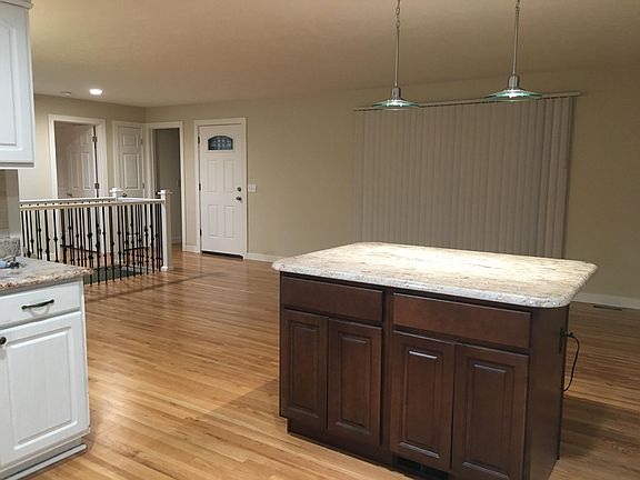 View of living room and entry from the kitchen