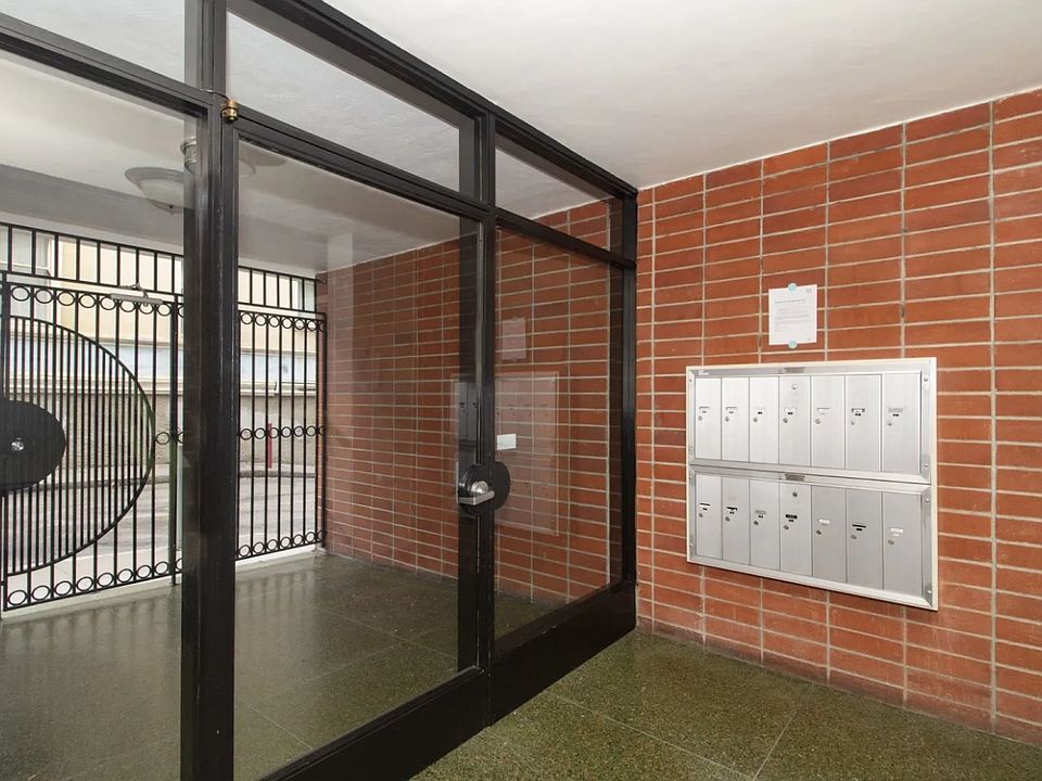 Main entrance door of the apartment building at 50 Joice St, San Francisco, CA 94108, United States