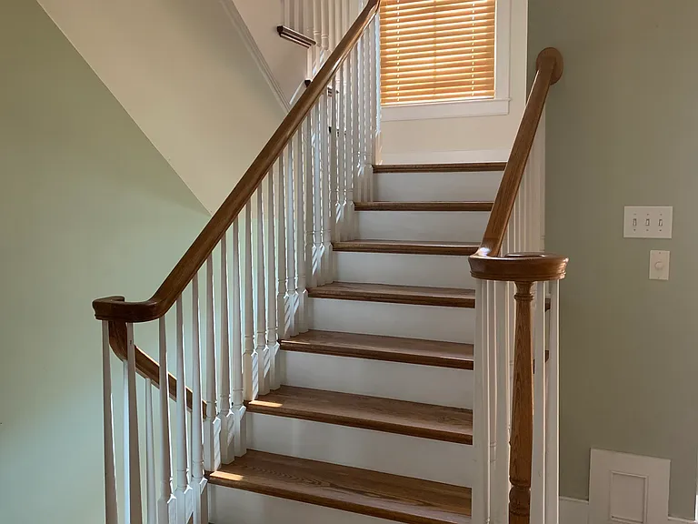 stairs to the second floor - primary suite and laundry