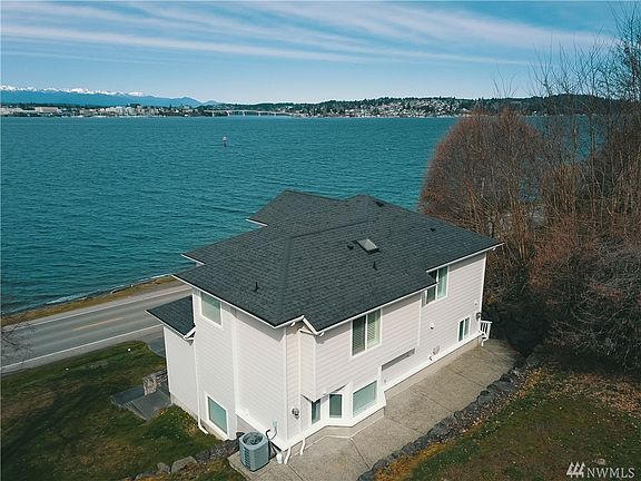 Be co-owner of 136' of Puget Sound Waterfront.  