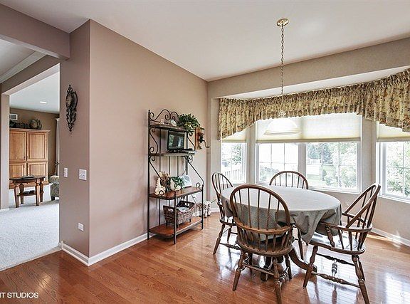Enjoy casual dining, Eating Area features Bay Window with views of Lushly Landscaped backyard......