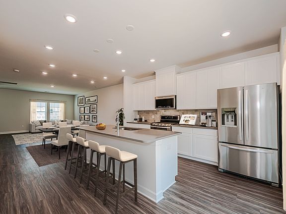 The well-appointed kitchen offers a walk-in pantry and ample counter space.