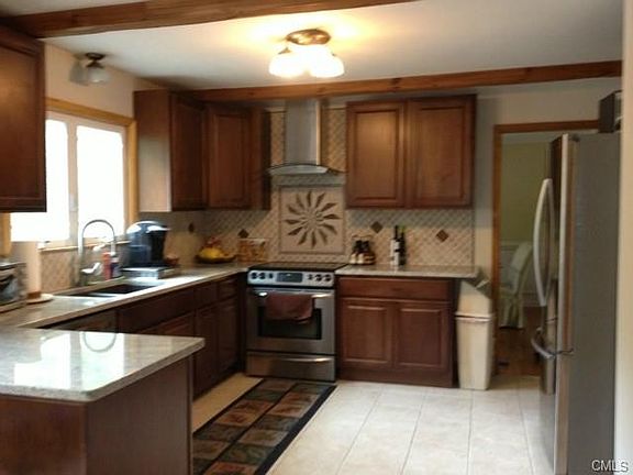 CUSTOM NEW KITCHEN LEADING TO FORMAL DINING ROOM