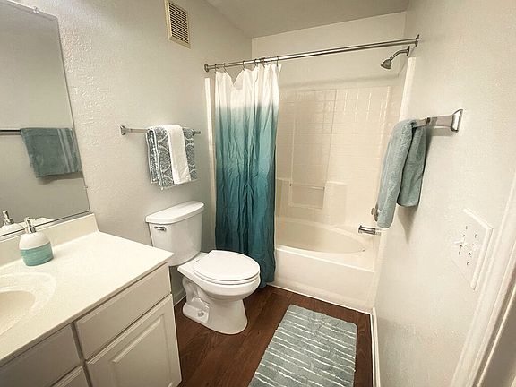 Full Bathroom with Wood Style Flooring