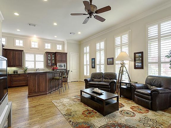 Spacious den opens to kitchen and has fabulous windows plus additional windows over the cabinets. Ch