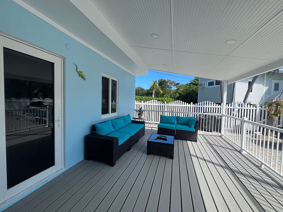 Private front porch with recessed lighting. Slight ocean views from porch and living room.