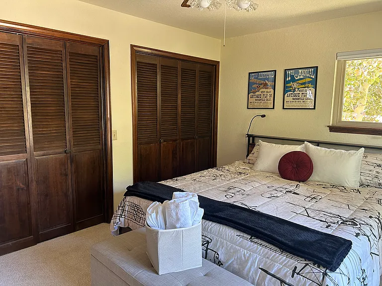 Third bedroom, more closet space, king size bed, lots of charging stations.