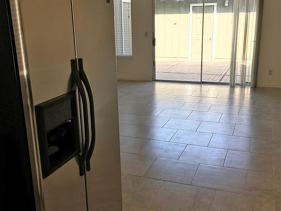 Sliding Glass Door to Patio and Garage