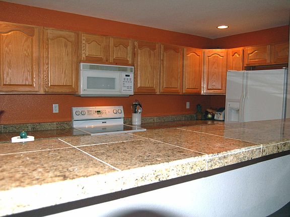 granite counters, pull-out shelves, pantry