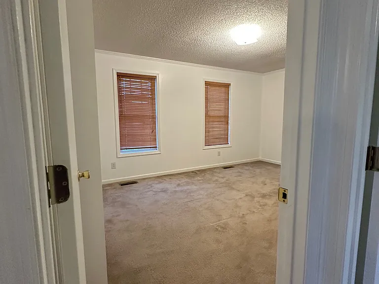 2nd Bedroom on the front side of the home with shampooed carpet