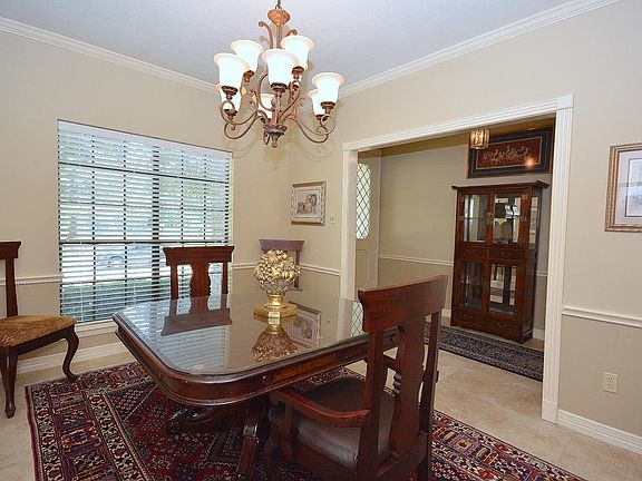 Elegant dining room is located just off the entry and adjacent to the kitchen