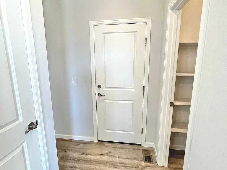 Garage door entry and pantry on the right