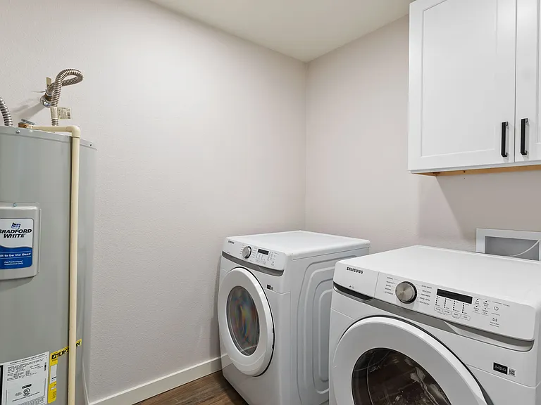 washer and dryer room with brand new appliances located on the right side of the house if you facing the front door