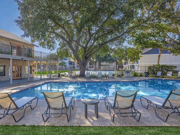 Experience the serene luxury of Distinction Apartment Homes, featuring a stunning poolside oasis surrounded by lush greenery. Enjoy relaxing afternoons and vibrant community amenities that elevate your living experience. Inquire today for more details!