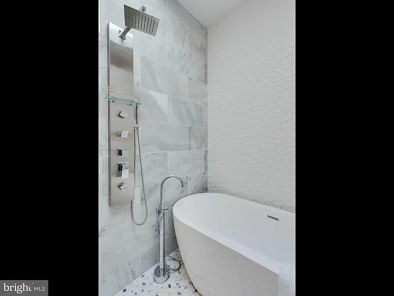 Master Bath: Dual vanities, Skylight, walk-in shower with freestanding tub
