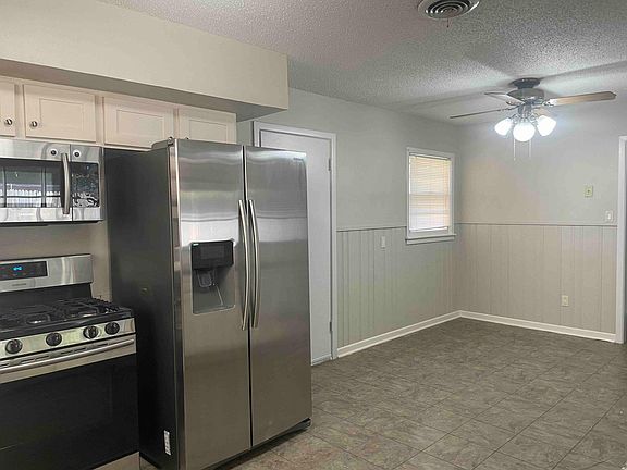 Home comes with refrigerator, microwave, washer and dryer. Laundry room is off of kitchen in private room. Dining is a great size for meals with the family.