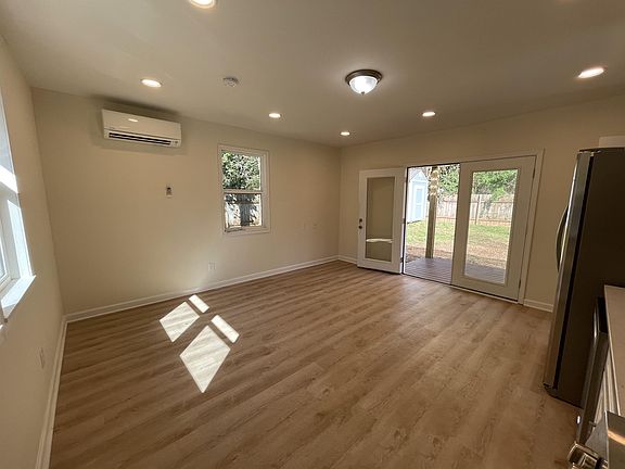 Opens up to personal balcony via double doors!