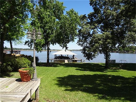 OPEN WATER VIEW OF LAKE AND BOAT HOUSE FROM HOT TUB