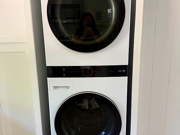 Brand-new stackable washer and dryer conveniently included, making laundry day easy while maximizing space.