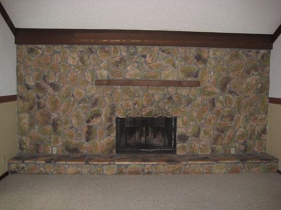 FAMILY ROOM HAS 16 FT STONE WALL / FIREPLACE