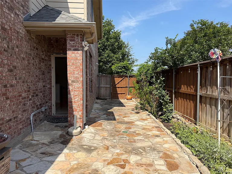 Stone patio and herb garden.