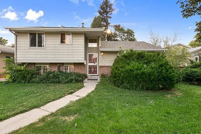 Front of house. Large bush removed and window decorative bars removed to let more natural light into house.