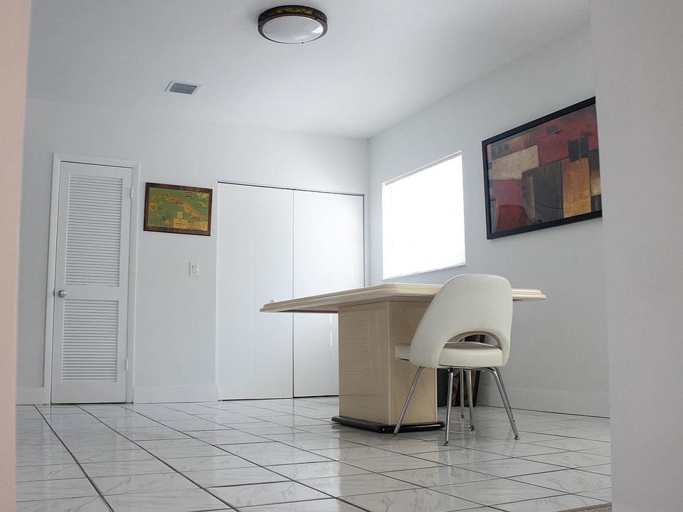 Bright dining/living area with large closet.