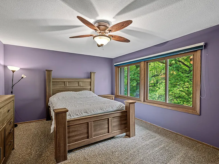 Large master bedroom with big closet. Window looks out to the back of home which is wooded area. Very private.