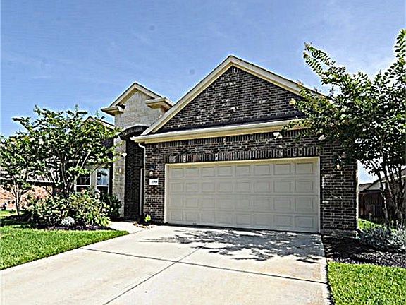 Custom Home with Added Recessed Lighting Around the Front Elevation. Looks Stunning at Night!