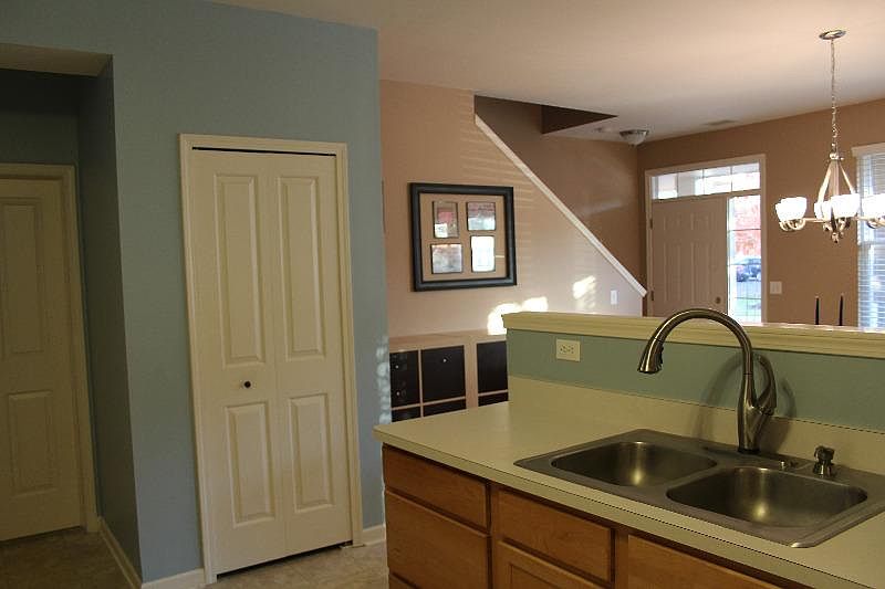 Kitchen that overlooks the great room and street