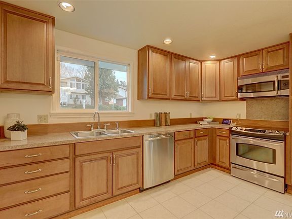 Large kitchen with stainless steel appliances 