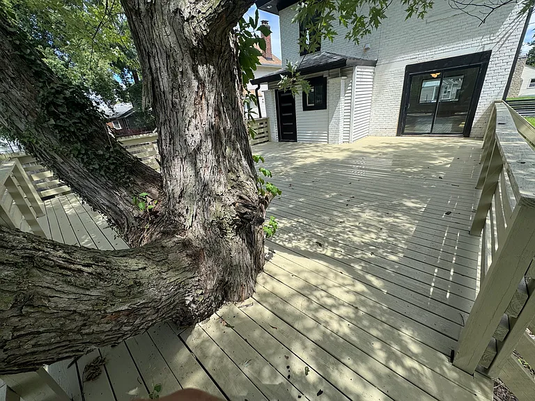 Huge, tree-shaded backyard deck!