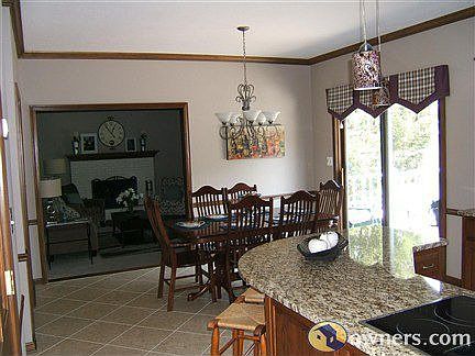 Large Breakfast Nook Overlooks Family Room and Deck