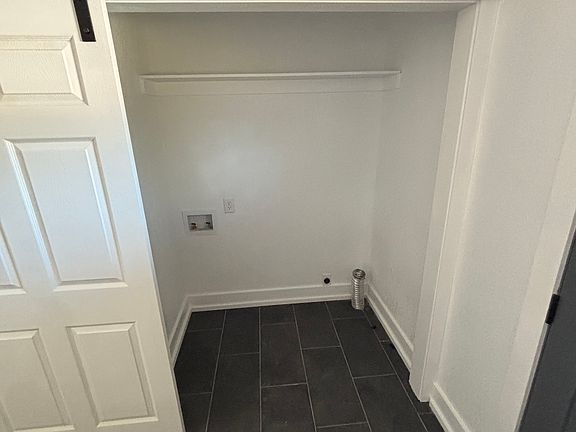 Laundry Room behind barn doors.